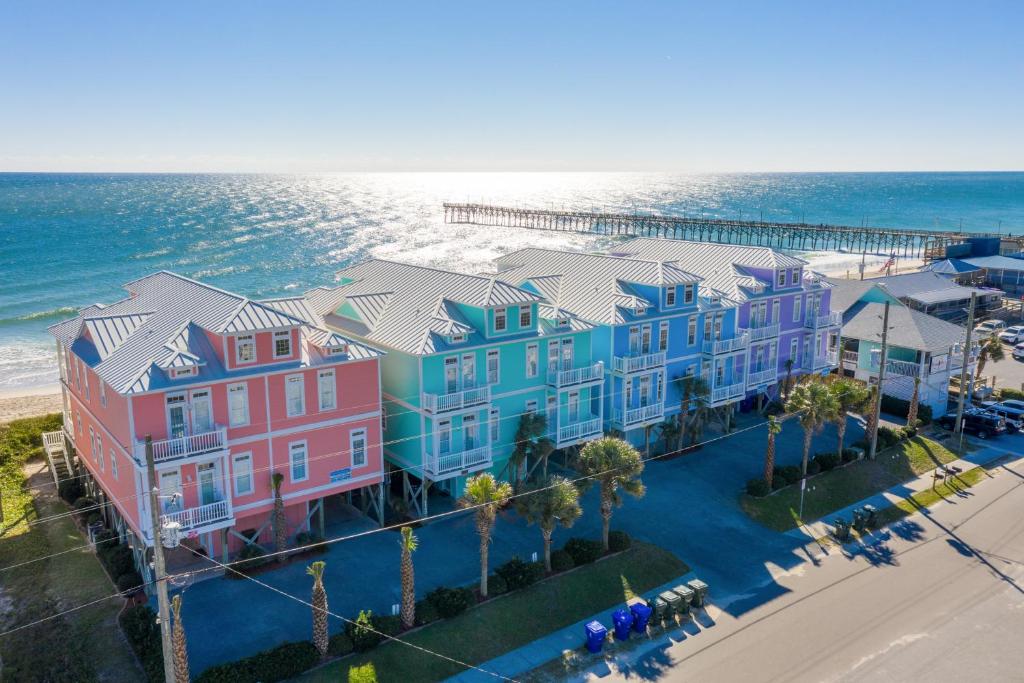 an aerial view of a row of houses next to the ocean at Your Turn in Surf City