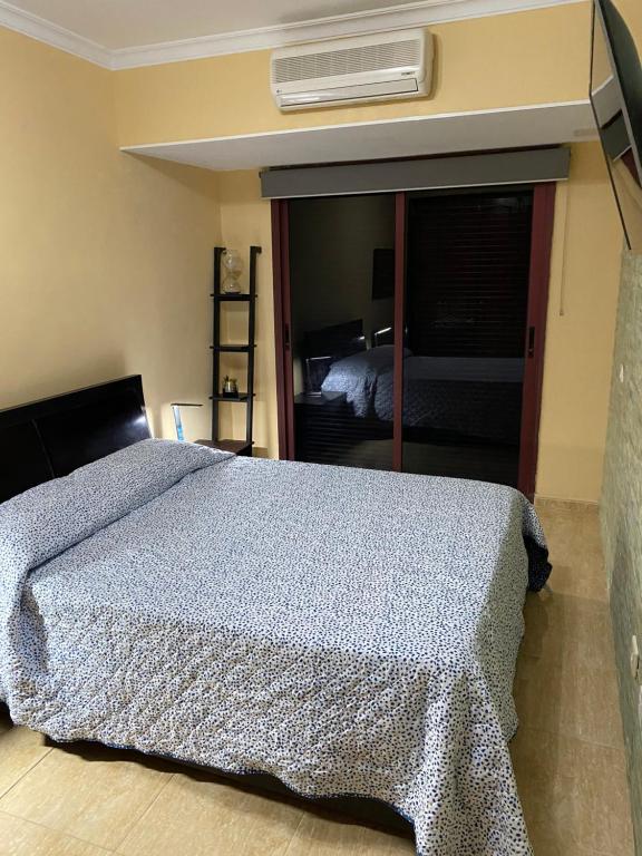 Postel nebo postele na pokoji v ubytování Villa Mogan Mall, con jacuzzi y PlayStation 5