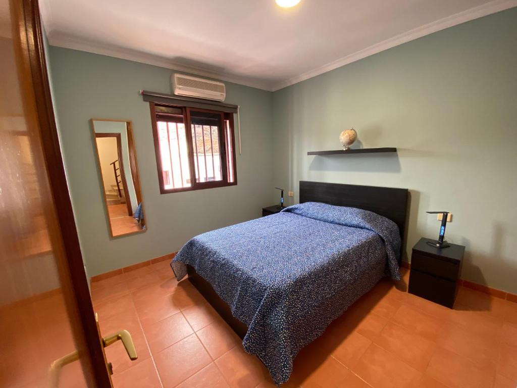 Postel nebo postele na pokoji v ubytování Villa Mogan Mall, con jacuzzi y PlayStation 5
