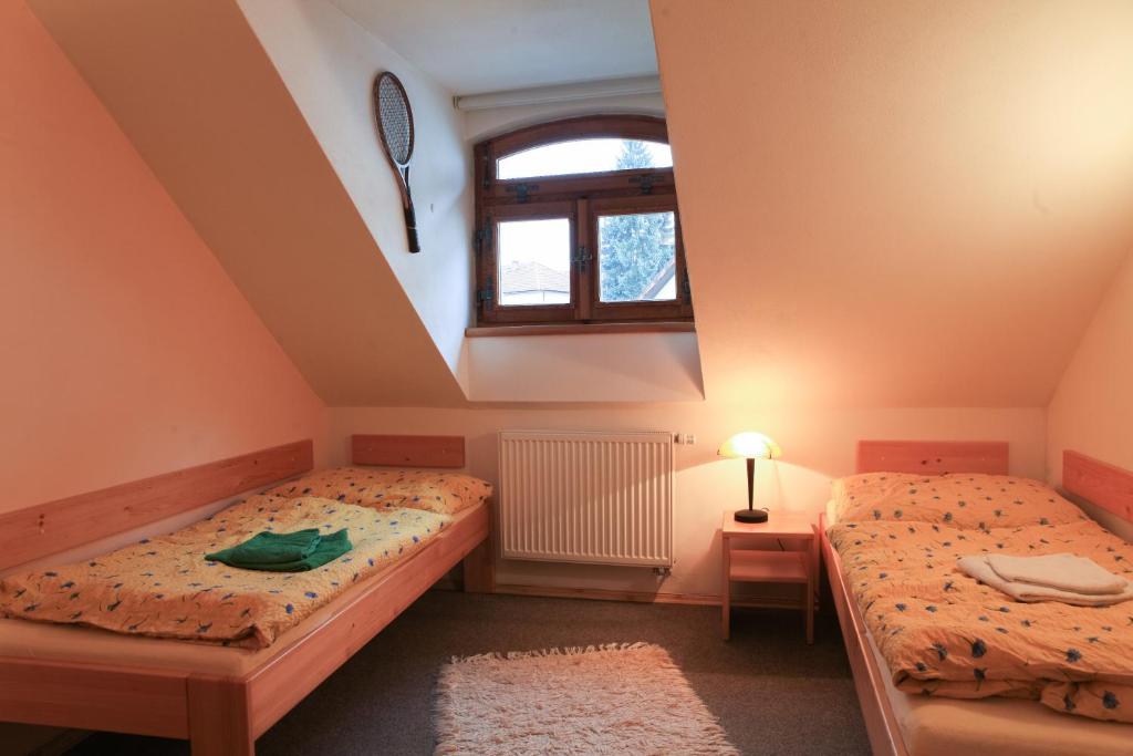 Postel nebo postele na pokoji v ubytování Penzion Čas