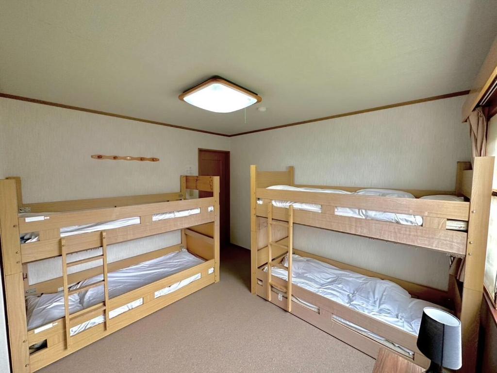 Postel nebo postele na pokoji v ubytování Absolute Niseko Lodge