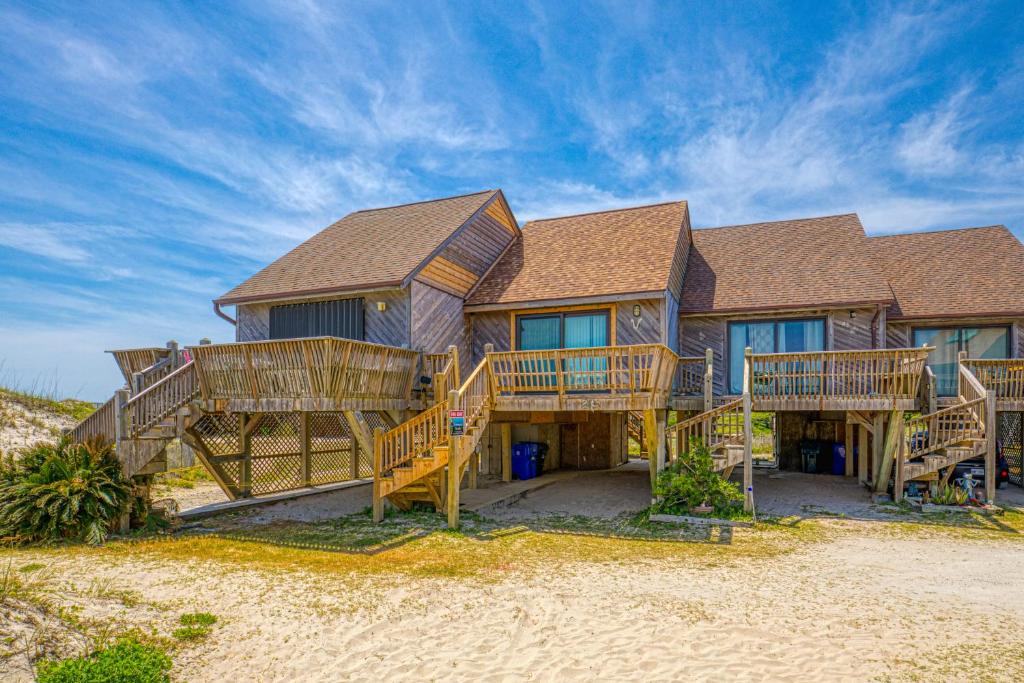 a house on the beach with wooden decks at Topsail Villa 24 in North Topsail Beach