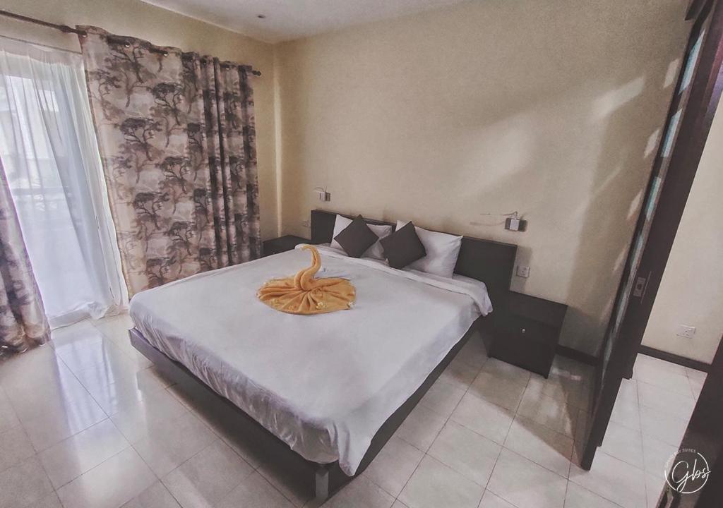 Postel nebo postele na pokoji v ubytování Grand Bay Suites