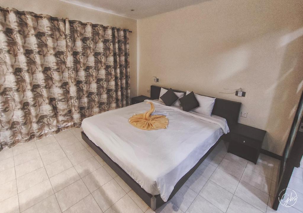 Postel nebo postele na pokoji v ubytování Grand Bay Suites
