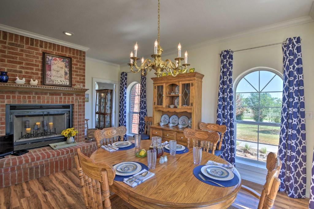 a dining room with a table and a fireplace at Peaceful Bellevue Gem on Working Cattle Ranch in Bellevue