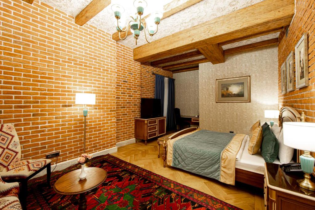 Postel nebo postele na pokoji v ubytování Sapphire Bayil Hotel