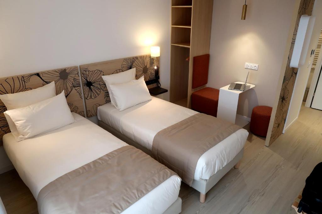 Letto o letti in una camera di COURRIER SUD