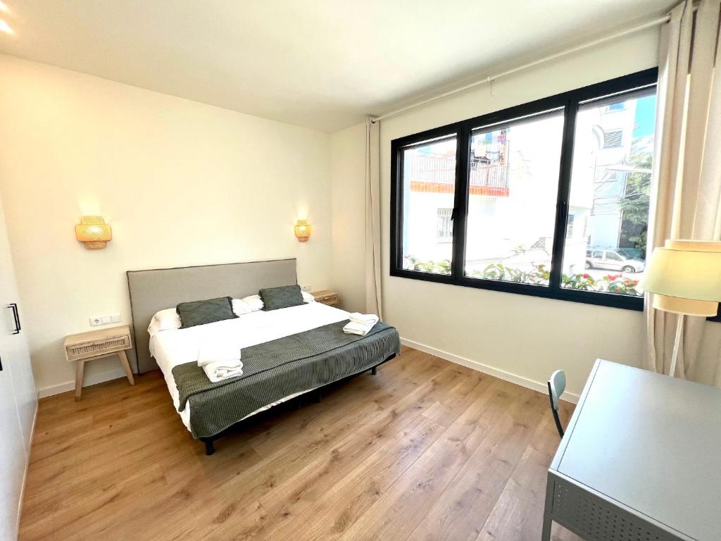 Postel nebo postele na pokoji v ubytování Hauzify I Apartaments Sant Pau