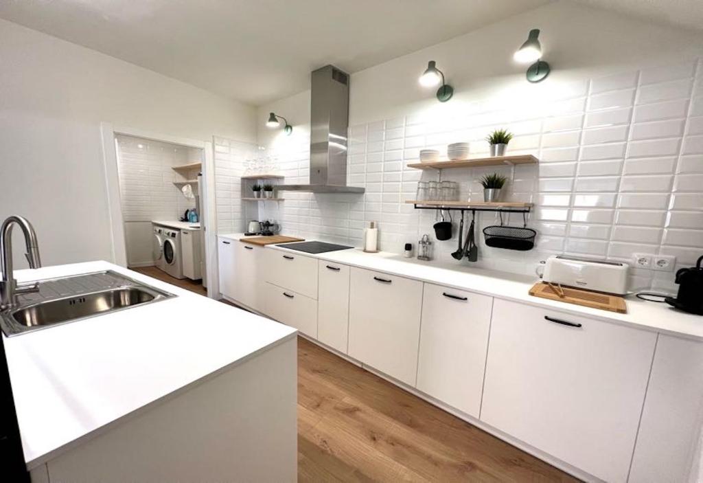 Kuchyň nebo kuchyňský kout v ubytování Hauzify I Apartaments Sant Pau