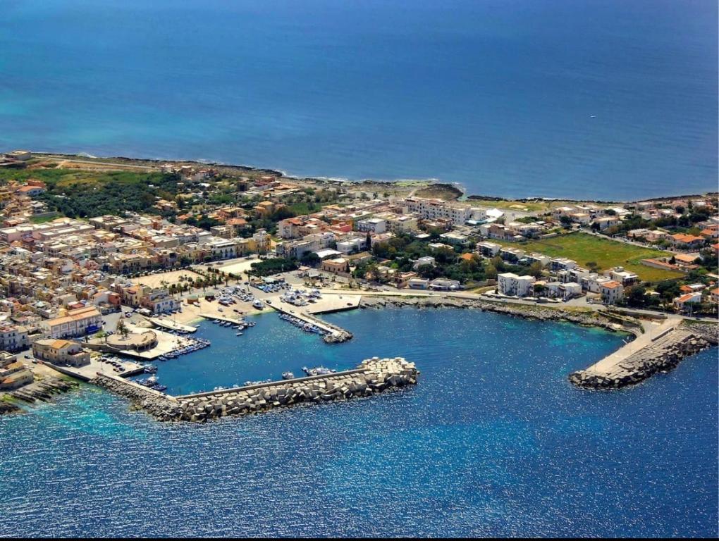an aerial view of a harbor with boats in the water at AR Palace Hotel - Palermo in Isola delle Femmine