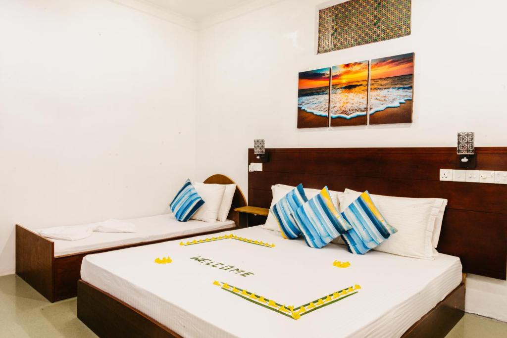 Postel nebo postele na pokoji v ubytování Sunset Beach View