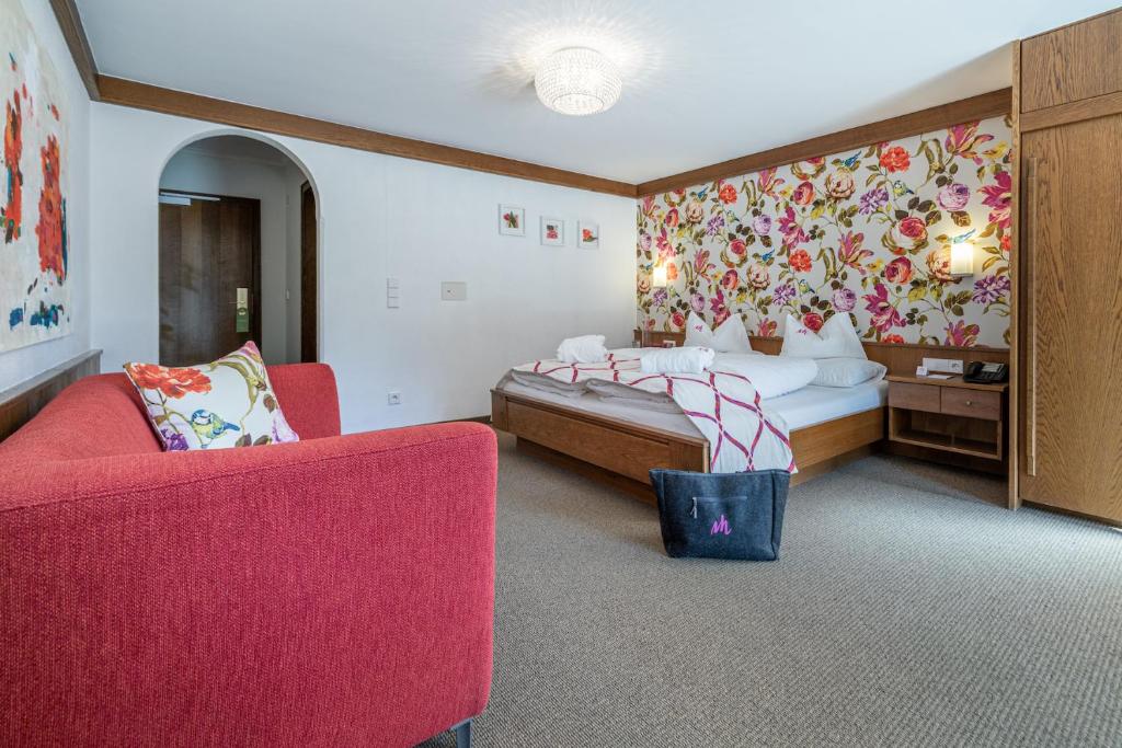 Łóżko lub łóżka w pokoju w obiekcie Alpin Art & Spa Hotel Naudererhof Superior