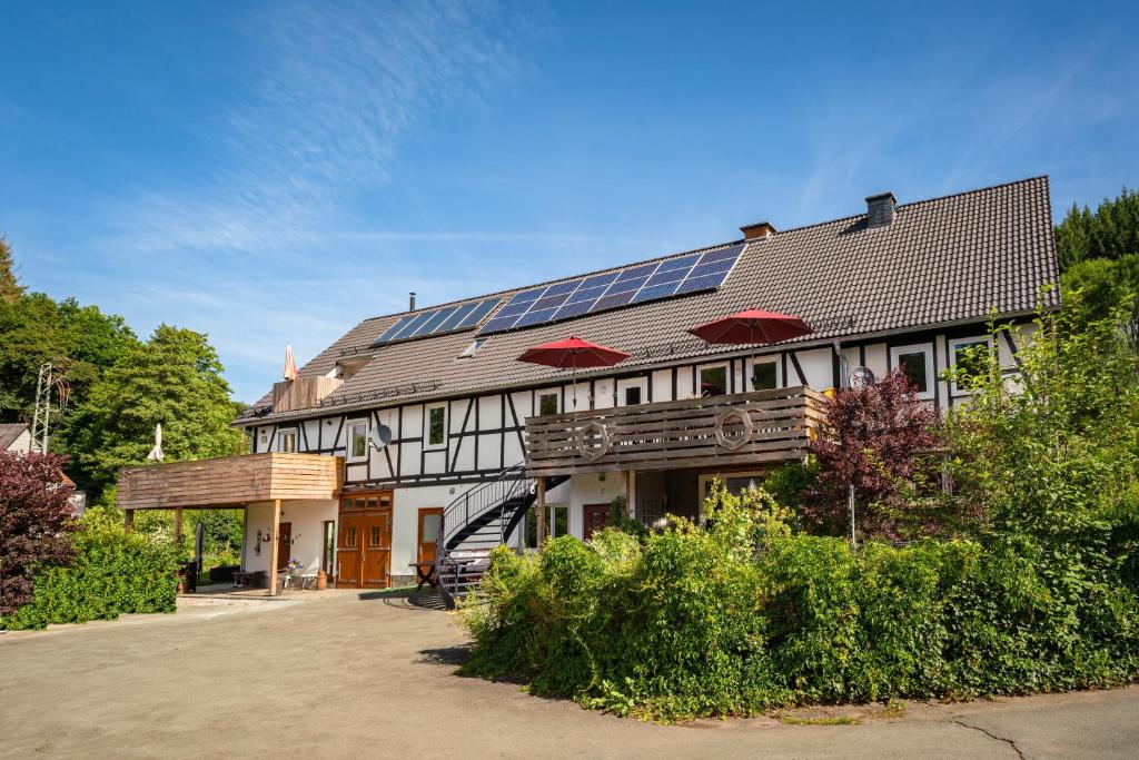 a house with solar panels on the roof at Haus am Wilde Aar in Medebach