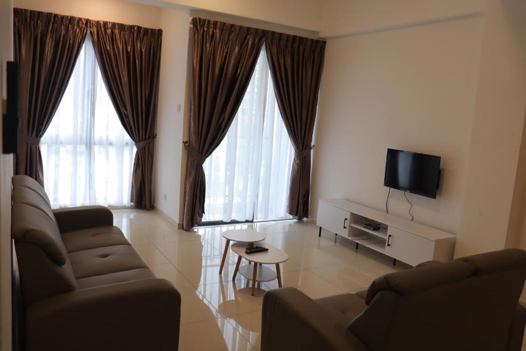 TV a/nebo společenská místnost v ubytování ATS Cameron Hotel & Apartments