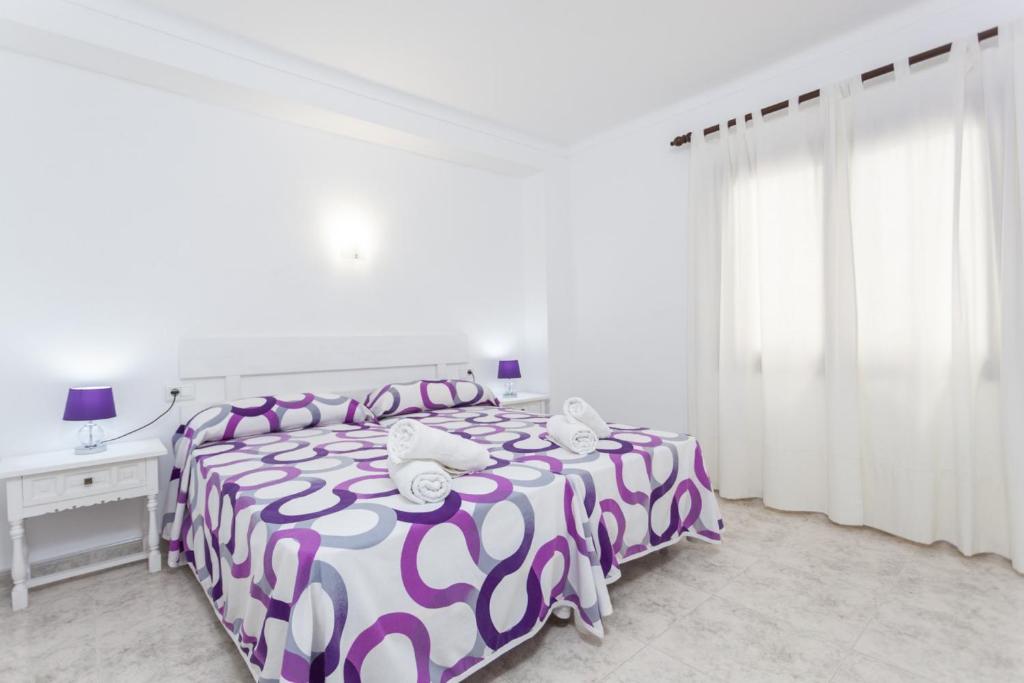 Postel nebo postele na pokoji v ubytování YourHouse Casa Suiza