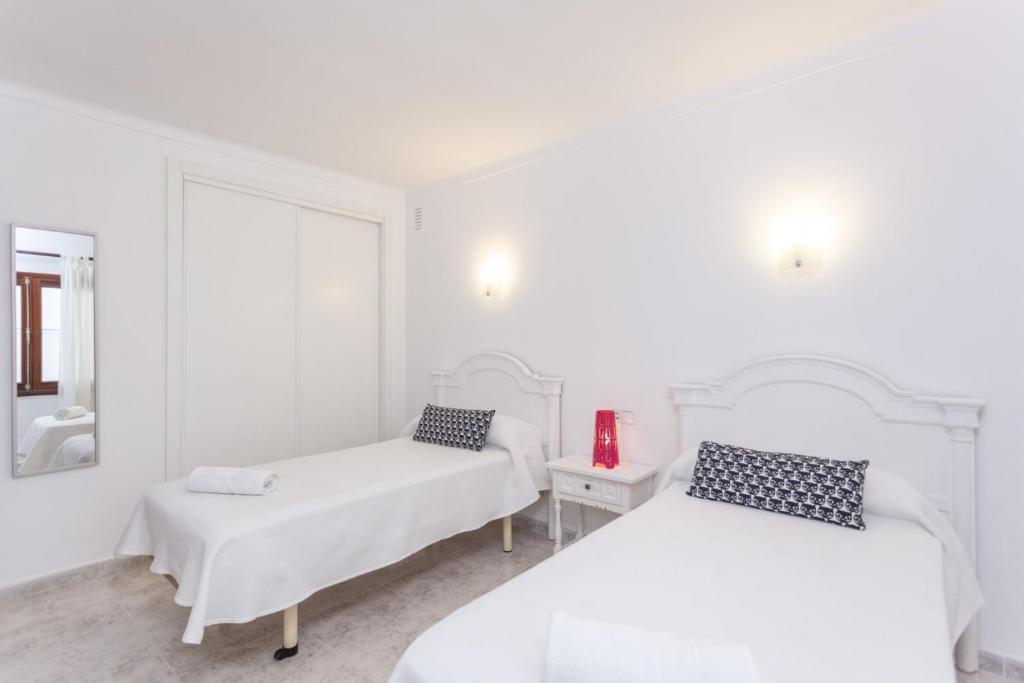 Postel nebo postele na pokoji v ubytování YourHouse Casa Suiza