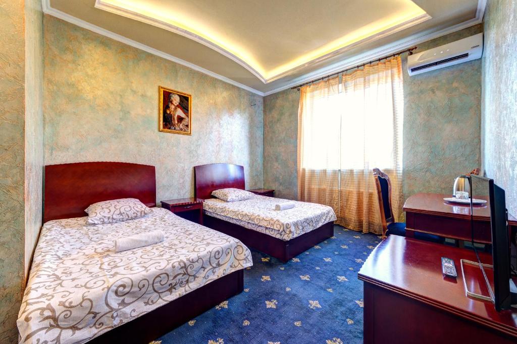 Postel nebo postele na pokoji v ubytování Hotel Kiev Lomakin