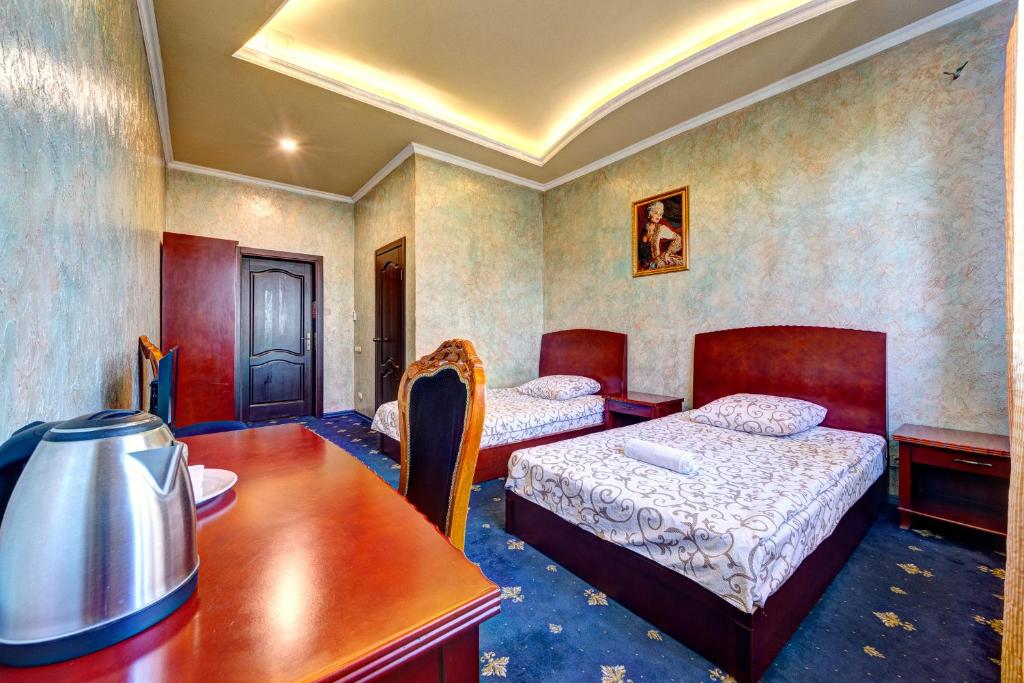 Postel nebo postele na pokoji v ubytování Hotel Kiev Lomakin