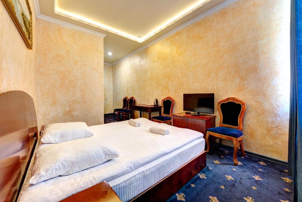 Postel nebo postele na pokoji v ubytování Hotel Kiev Lomakin