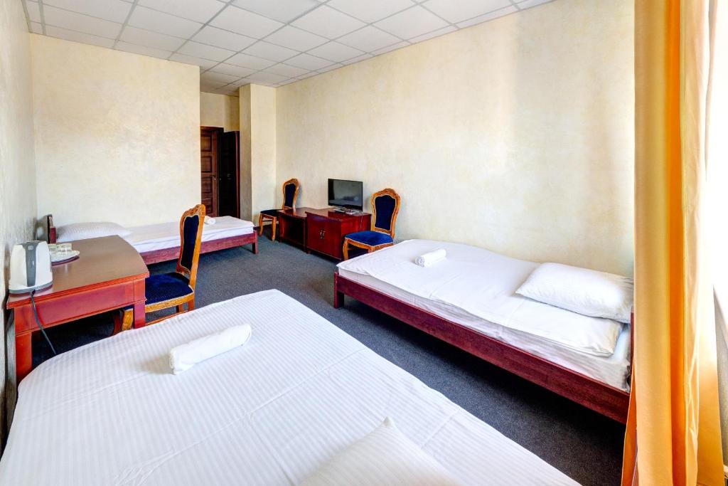Postel nebo postele na pokoji v ubytování Hotel Kiev Lomakin