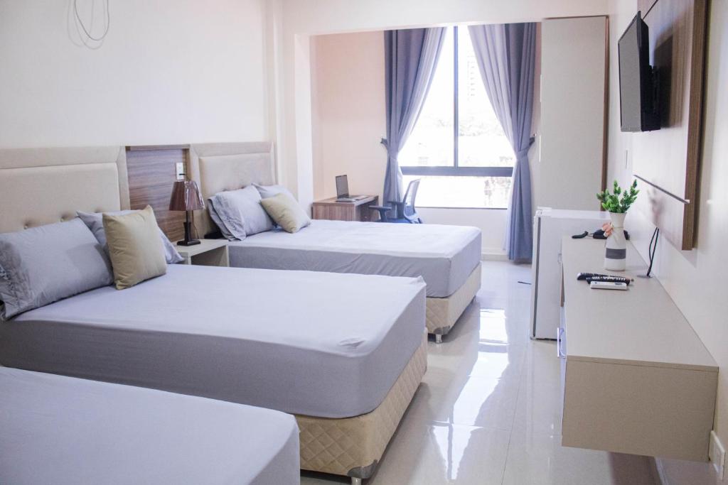 Postel nebo postele na pokoji v ubytování Liebling Hotel Ciudad del Este