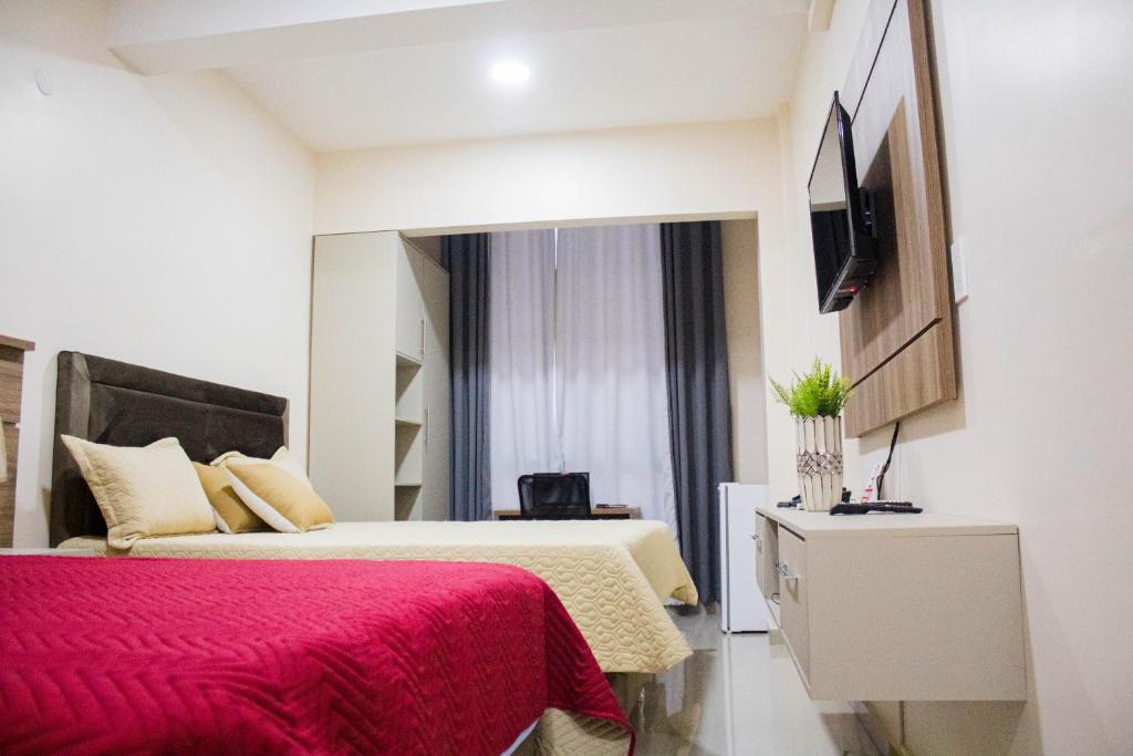 Postel nebo postele na pokoji v ubytování Liebling Hotel Ciudad del Este