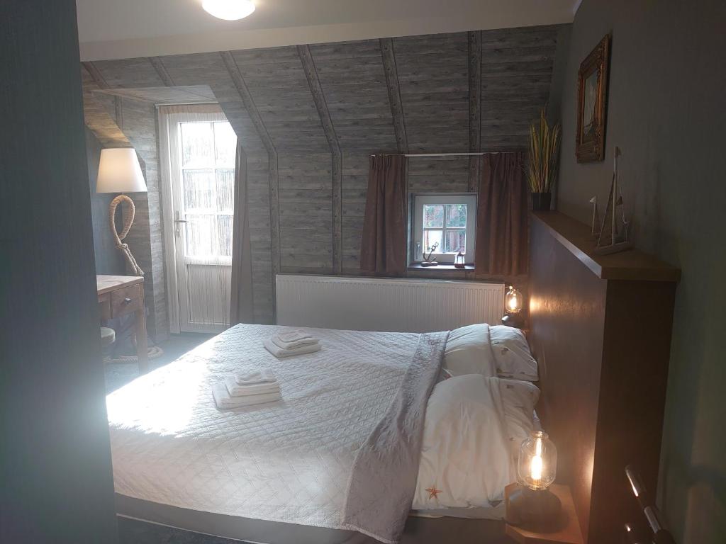 Postel nebo postele na pokoji v ubytování De Cyprian Bed & Breakfast