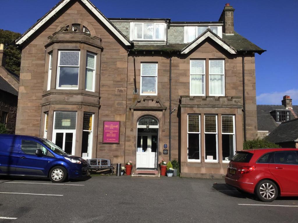 a house with two cars parked in front of it at Belvedere Guest House in Stonehaven