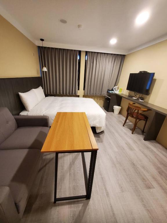 TV a/nebo společenská místnost v ubytování Yoshi Hotel - Tainan Station Branch