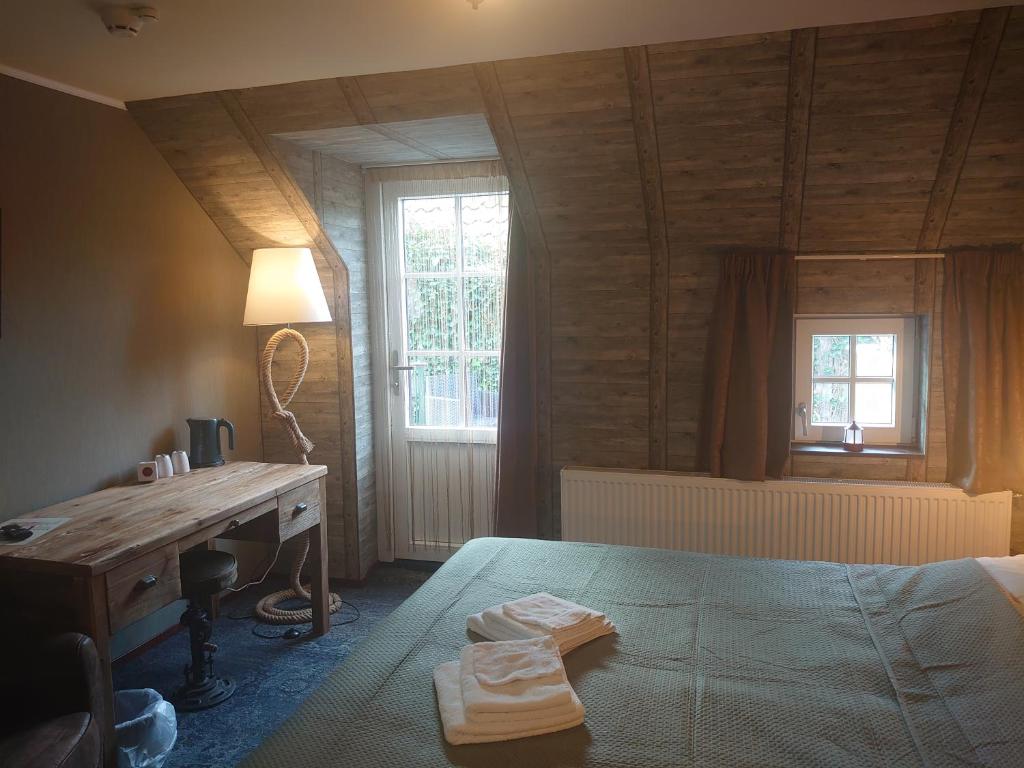 Postel nebo postele na pokoji v ubytování De Cyprian Bed & Breakfast