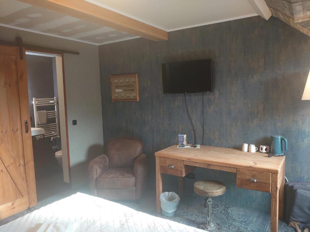 TV a/nebo společenská místnost v ubytování De Cyprian Bed & Breakfast