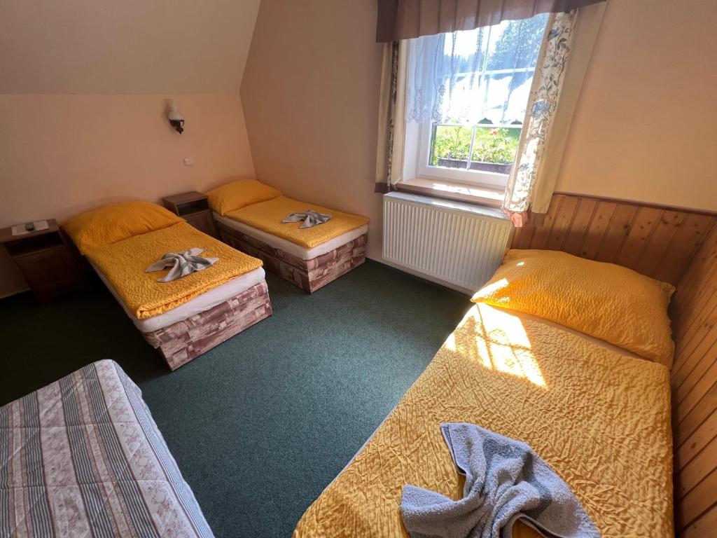 Postel nebo postele na pokoji v ubytování Chalupa Na stráni