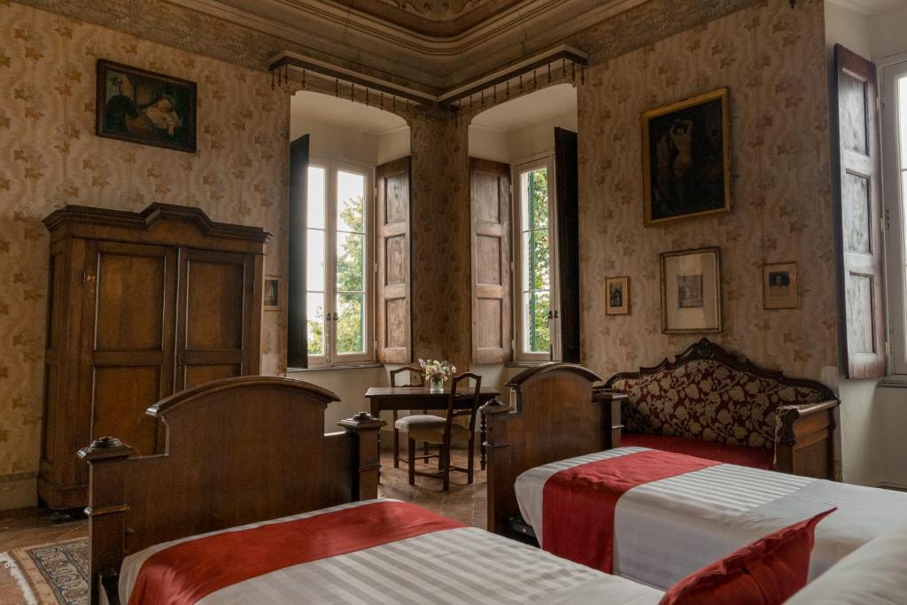 Postel nebo postele na pokoji v ubytování Albergo Real Castello
