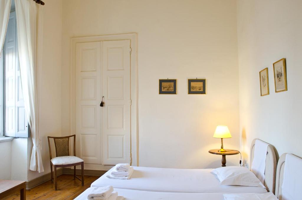 Łóżko lub łóżka w pokoju w obiekcie Hotel Omiros