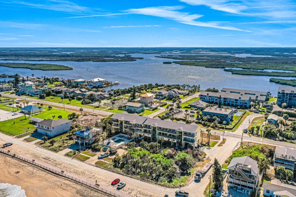 an aerial view of a resort next to a body of water at Ocean Vue in New Smyrna Beach