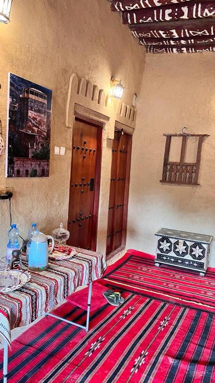 Postel nebo postele na pokoji v ubytování Alqalah Inn
