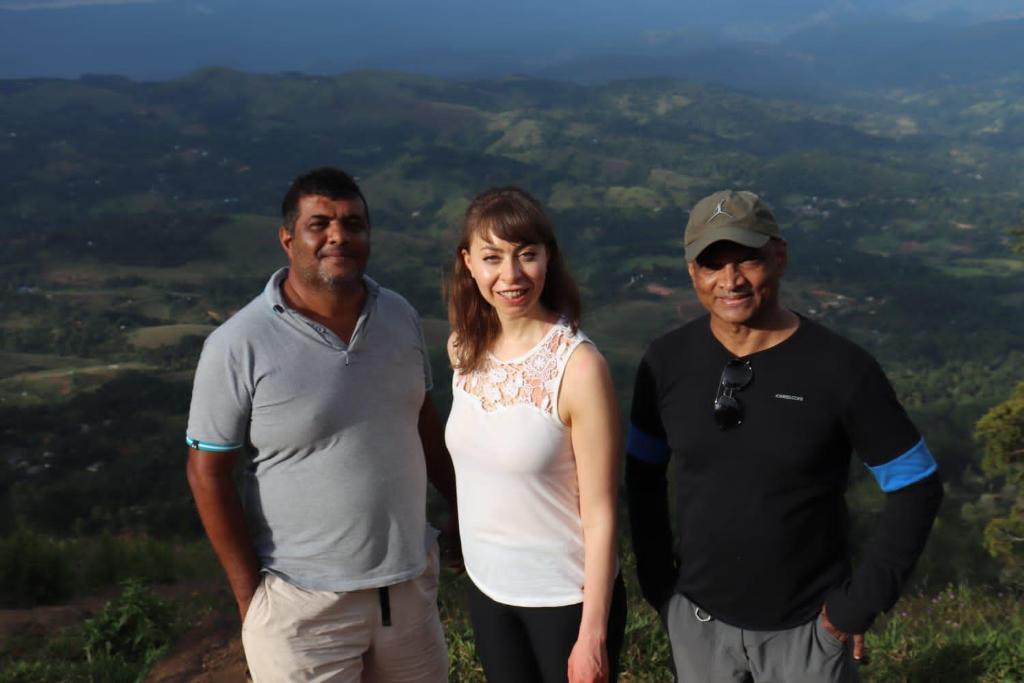 a group of three people standing on top of a mountain at Galaha Eco Camping 1 in Kandy