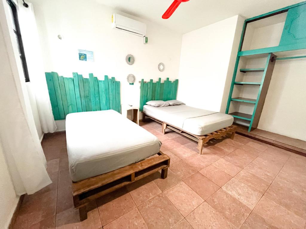 Postel nebo postele na pokoji v ubytování Casa Cálido Hotel
