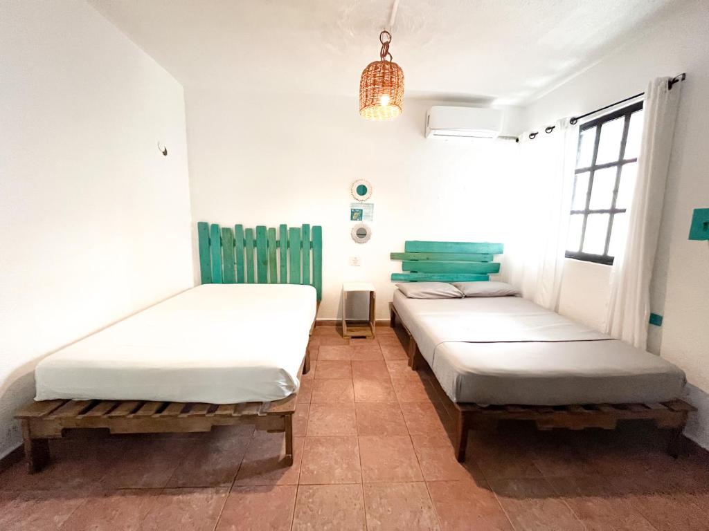 Postel nebo postele na pokoji v ubytování Casa Cálido Hotel