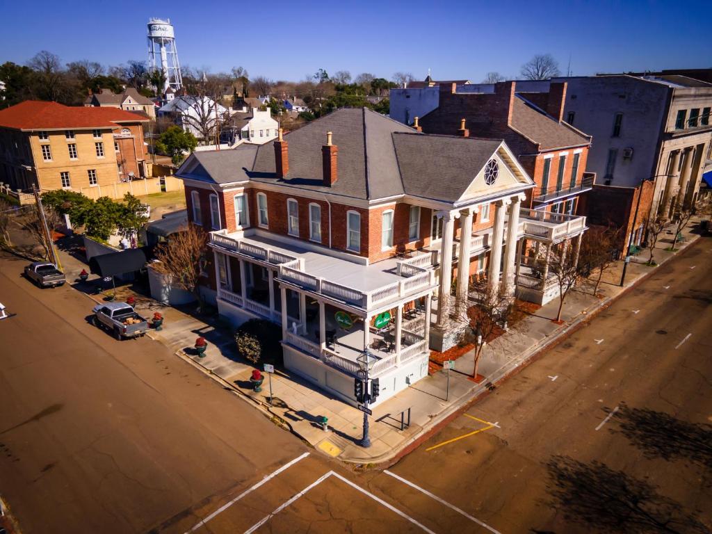 an overhead view of a large house on a city street at The Guest House Historic Mansion in Natchez