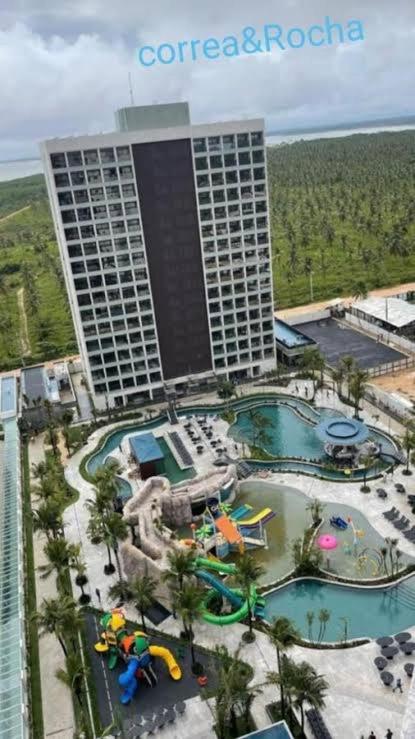 an aerial view of a hotel with a water park at salinas premium resort in Salinópolis