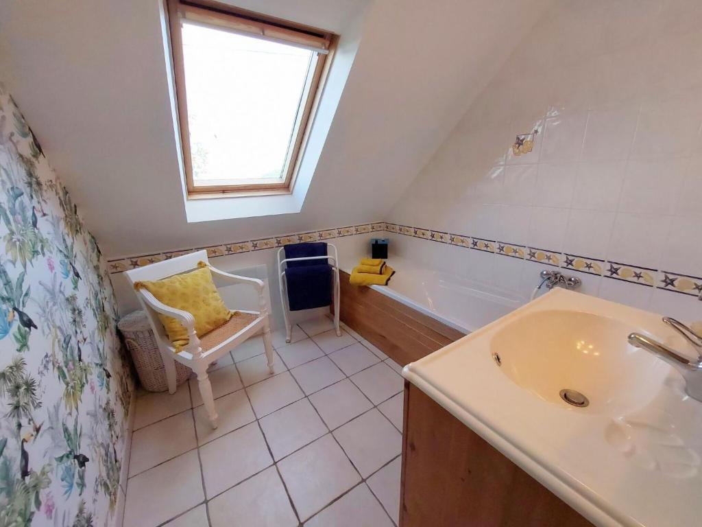 a bathroom with a sink and a bath tub at Granite stone house with fireplace, Plouguerneau in Plouguerneau