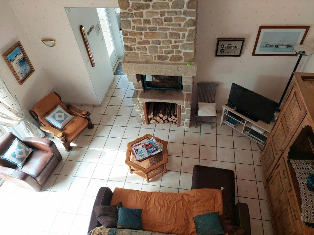 an overhead view of a living room with a fireplace at Granite stone house with fireplace, Plouguerneau in Plouguerneau