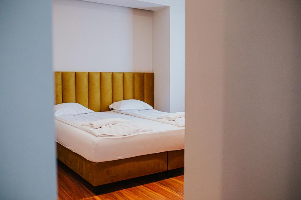 Postel nebo postele na pokoji v ubytování HOTEL VITAL