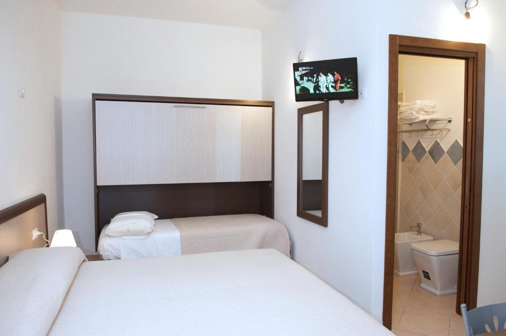 Postel nebo postele na pokoji v ubytování Domo - Guest-House Il Nespolo Fiorito