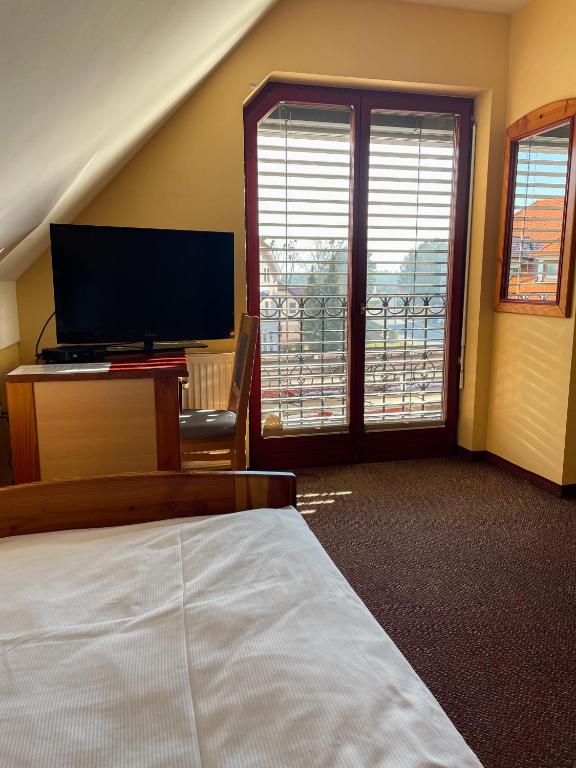 TV a/nebo společenská místnost v ubytování Guesthouse Jurcek