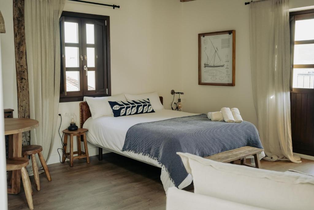 Кровать или кровати в номере Apartamentos Etxetxu Branka eta Ankora