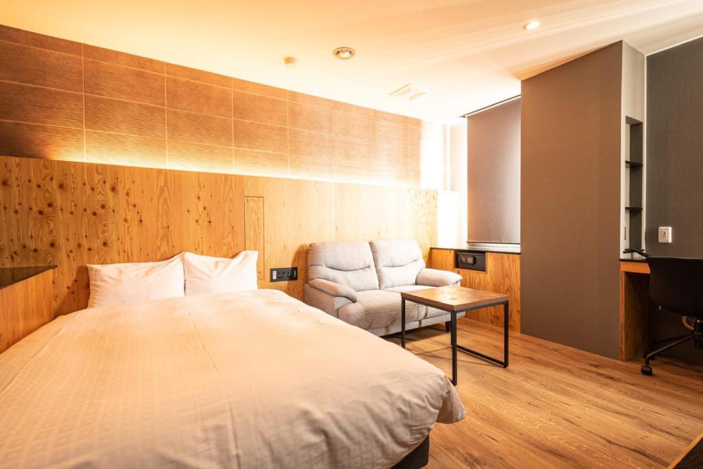 Postel nebo postele na pokoji v ubytování ArC LIFESTYLE SPACE & HOTEL
