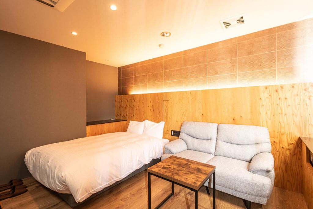 Postel nebo postele na pokoji v ubytování ArC LIFESTYLE SPACE & HOTEL