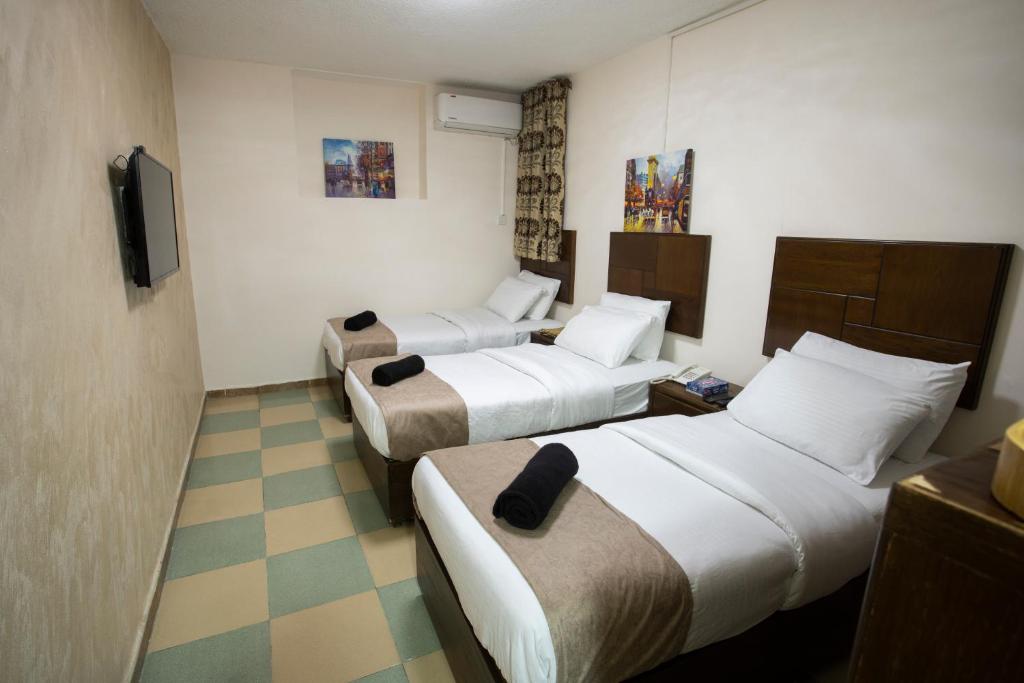 Postel nebo postele na pokoji v ubytování Darak hotel